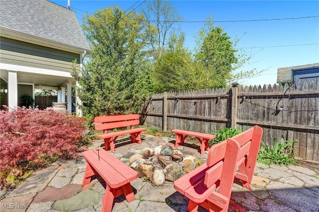 view of yard featuring fence and a patio area