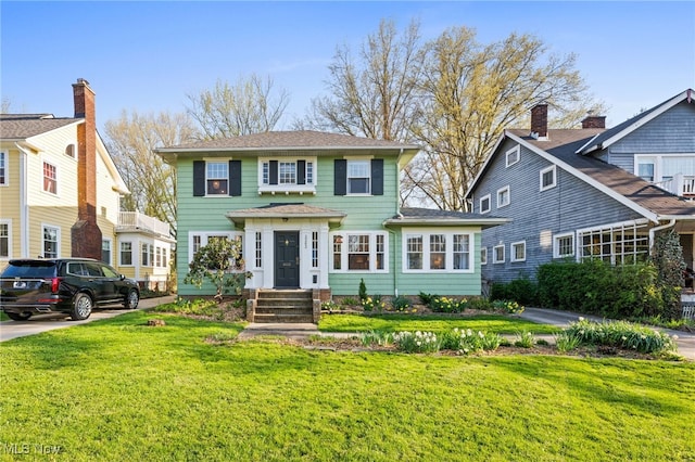 view of front of home featuring a front lawn