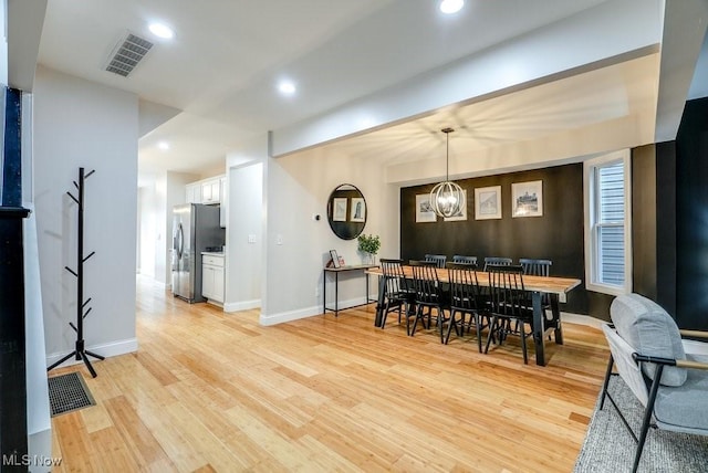 dining space with recessed lighting, baseboards, visible vents, and light wood finished floors