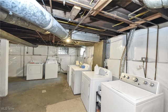 washroom with laundry area and washer and dryer