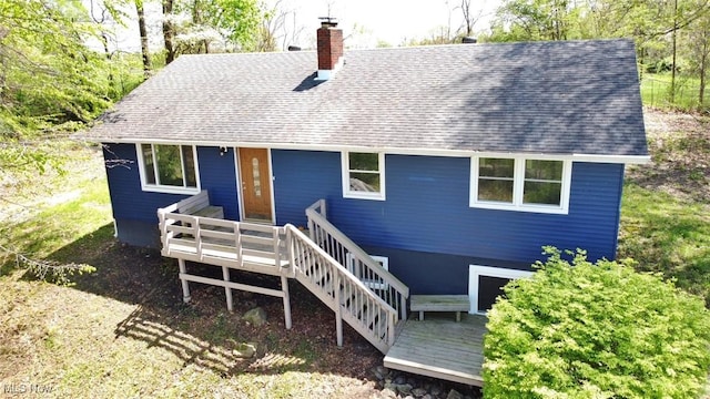 6720 Prior Rd, Nashport, OH 43830 - view of front of home with roof with shingles, a wooden deck, and a chimney