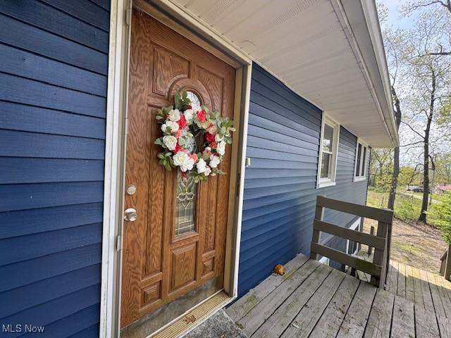 6720 Prior Rd, Nashport, OH 43830 - doorway to property featuring covered porch