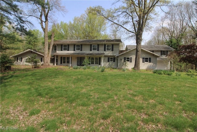 rear view of house with a lawn