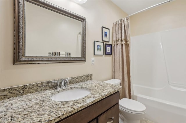full bath featuring toilet, shower / tub combo with curtain, and vanity