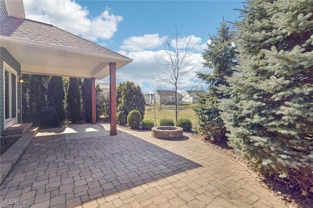 view of patio / terrace featuring a fire pit