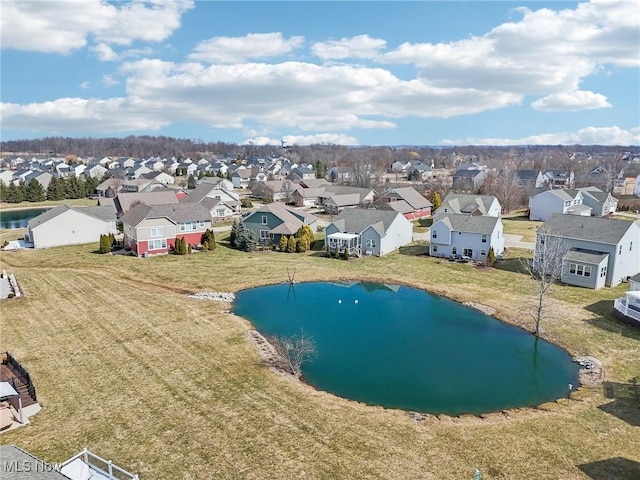 aerial view with a residential view and a water view