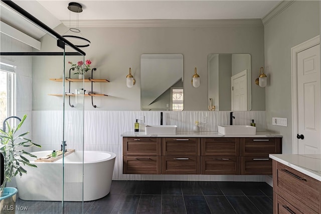 3340 Woodling Way, Medina, OH 44256 - full bathroom featuring double vanity, a freestanding bath, crown molding, a sink, and a wainscoted wall