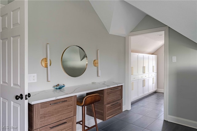 3340 Woodling Way, Medina, OH 44256 - bathroom with vanity, baseboards, tile patterned flooring, and vaulted ceiling