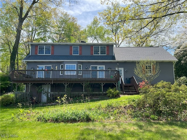 back of house featuring a deck