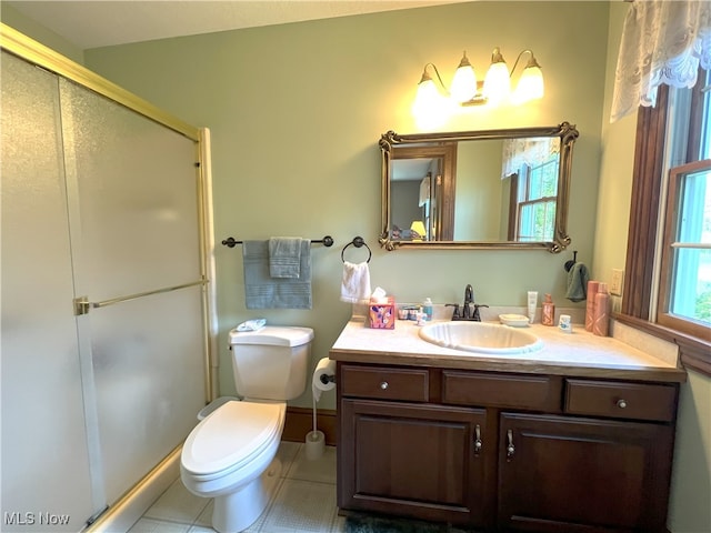 full bath featuring vanity, tile patterned flooring, a stall shower, and toilet