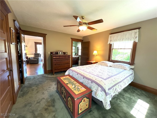 bedroom featuring carpet floors, baseboards, and a ceiling fan