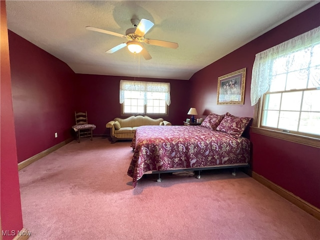 bedroom featuring carpet floors, baseboards, ceiling fan, and lofted ceiling