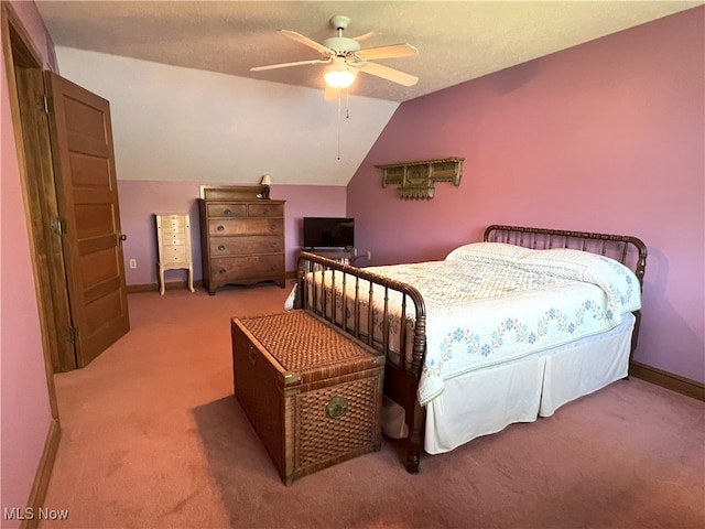 carpeted bedroom with baseboards, ceiling fan, and lofted ceiling