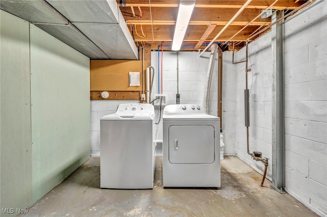 clothes washing area with independent washer and dryer and laundry area