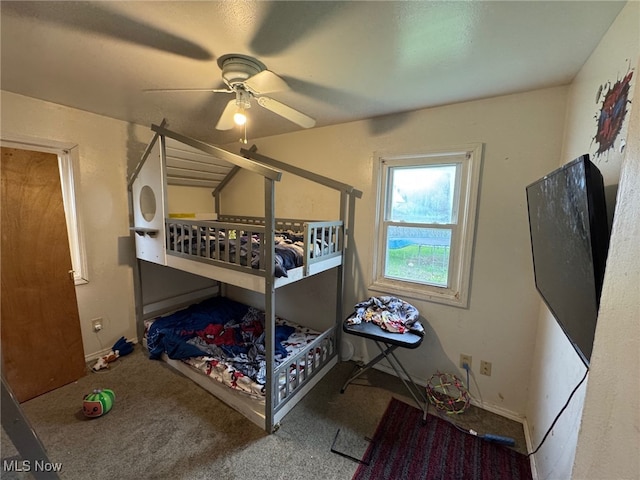 carpeted bedroom with baseboards and a ceiling fan