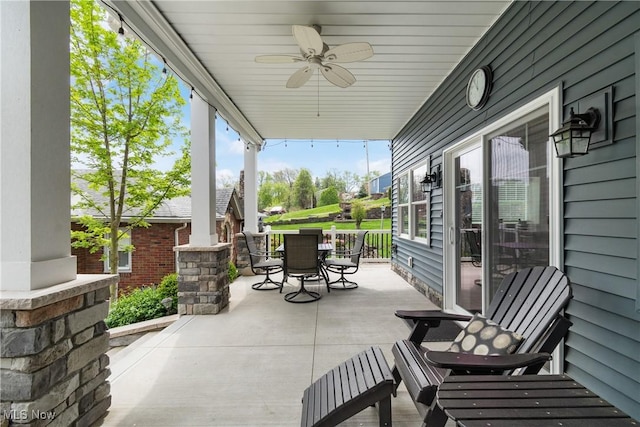 view of patio / terrace with outdoor dining area and ceiling fan