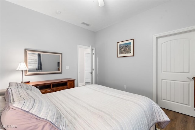 bedroom featuring ceiling fan, wood finished floors, and visible vents