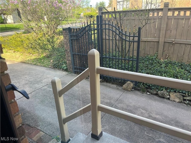 view of gate featuring fence