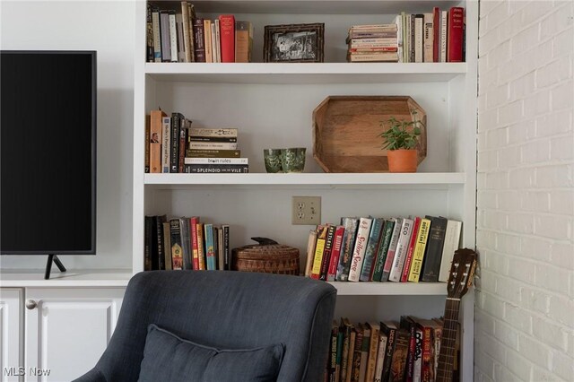 sitting room with built in shelves