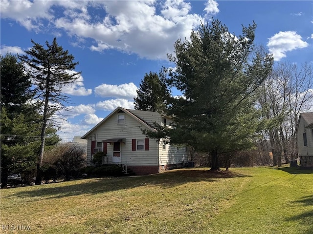 view of side of property with a yard
