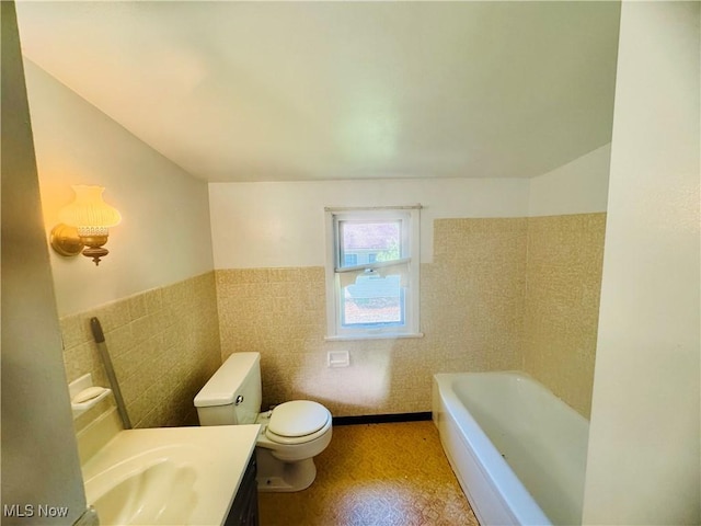 25911 Tryon Rd, Oakwood Village, OH 44146 - bathroom with a tub, toilet, vanity, tile walls, and a wainscoted wall
