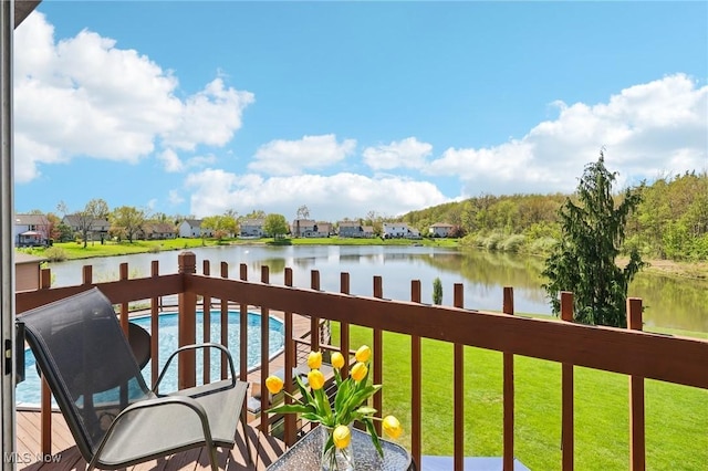balcony featuring a water view