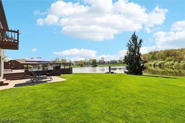 view of yard with a gazebo, a water view, and a patio area