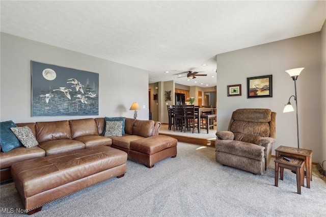 living room featuring recessed lighting, ceiling fan, and carpet