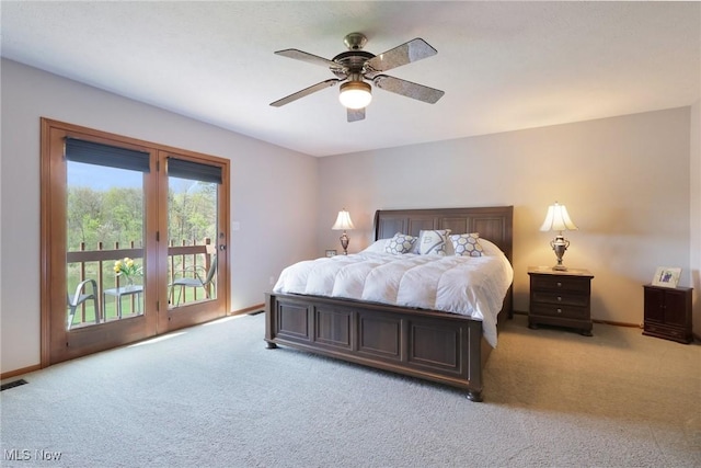 bedroom with ceiling fan, light colored carpet, access to exterior, baseboards, and visible vents