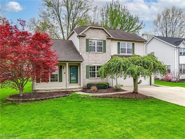 traditional home with a garage, driveway, roof with shingles, and a front lawn