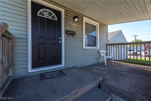 doorway to property featuring covered porch