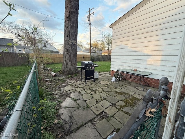 view of patio / terrace with area for grilling and a fenced backyard