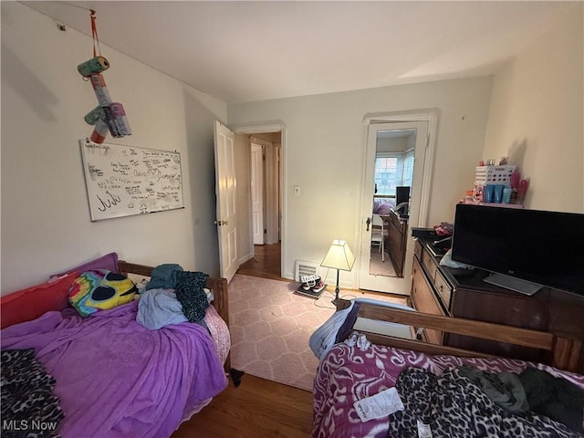 bedroom featuring wood finished floors