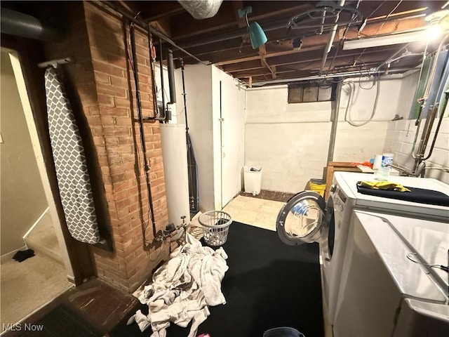 unfinished below grade area with separate washer and dryer and gas water heater