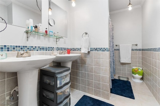 full bath with tile walls, wainscoting, tile patterned floors, toilet, and ornamental molding