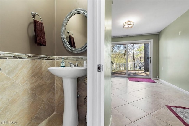 bathroom with tile patterned flooring and a sink