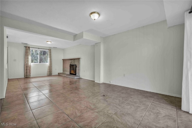 unfurnished living room featuring tile patterned floors and a fireplace