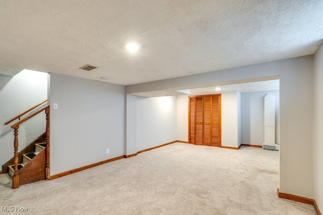 3860 Colony Rd, South Euclid, OH 44118 - finished below grade area with carpet floors, a textured ceiling, visible vents, and stairs