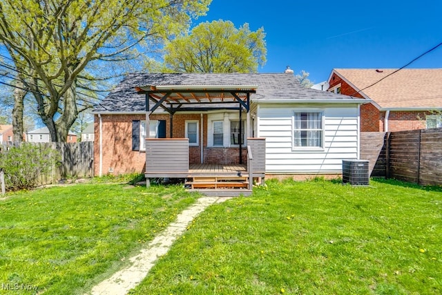 3860 Colony Rd, South Euclid, OH 44118 - view of front of home with a fenced backyard, a front lawn, and a deck