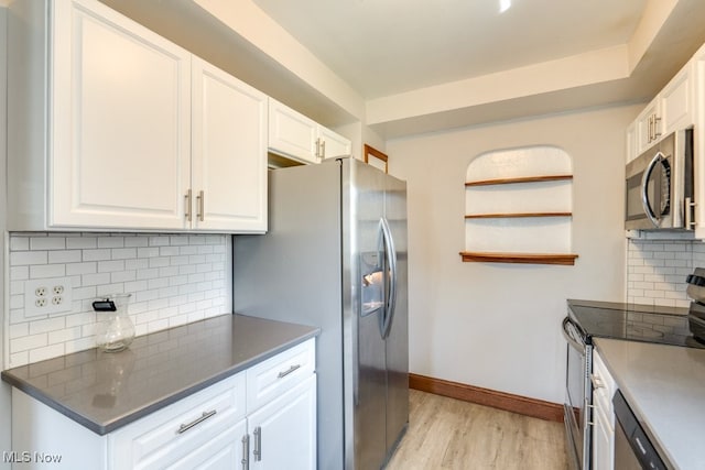 3860 Colony Rd, South Euclid, OH 44118 - kitchen featuring white cabinetry, appliances with stainless steel finishes, decorative backsplash, and light wood finished floors