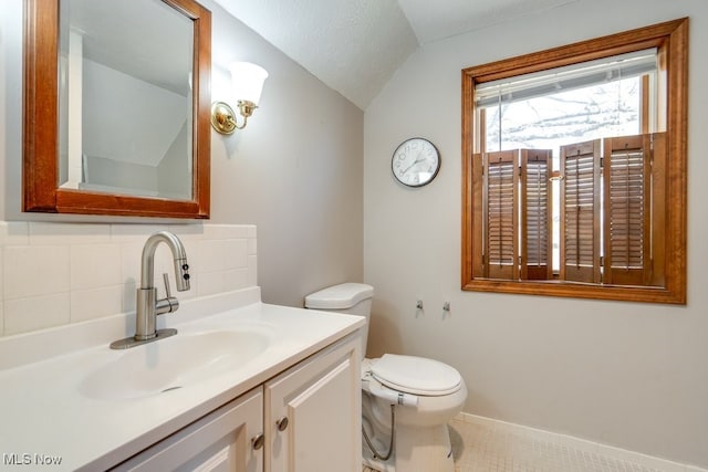 3860 Colony Rd, South Euclid, OH 44118 - bathroom featuring vanity, decorative backsplash, vaulted ceiling, and toilet