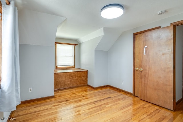 3860 Colony Rd, South Euclid, OH 44118 - additional living space featuring baseboards, vaulted ceiling, and light wood-style floors