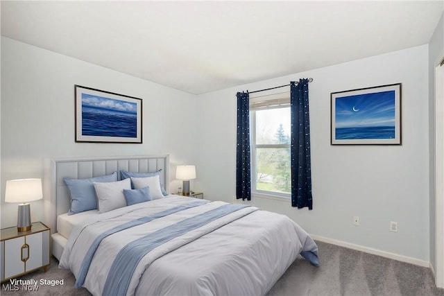 carpeted bedroom featuring baseboards