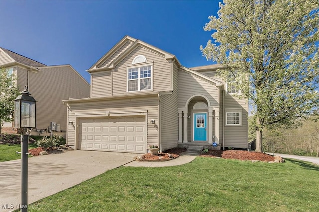 traditional home with concrete driveway, a front yard, and a garage