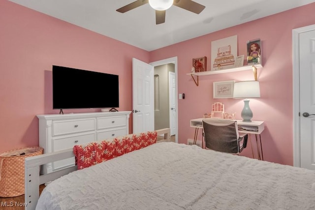 bedroom with baseboards and a ceiling fan