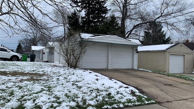 snow covered garage with a garage