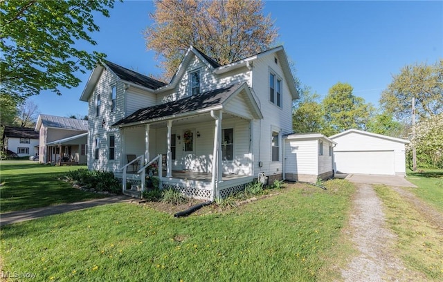 22 Cooper St, Wakeman, OH 44889 - view of front of property featuring a detached garage, a front yard, an outbuilding, covered porch, and driveway