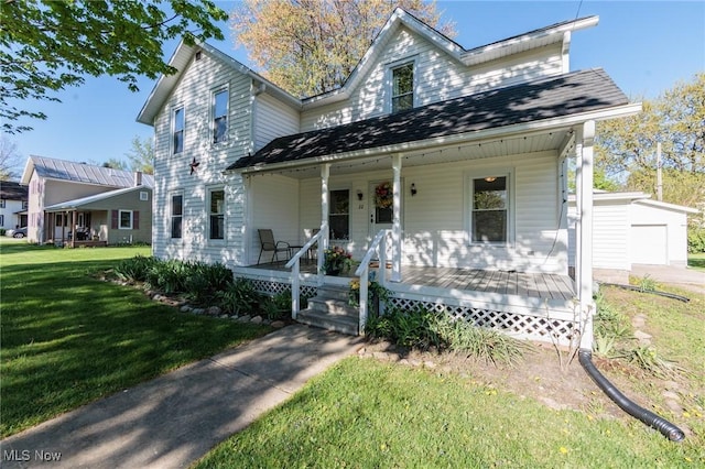 22 Cooper St, Wakeman, OH 44889 - view of front of house featuring covered porch, a front yard, and a garage