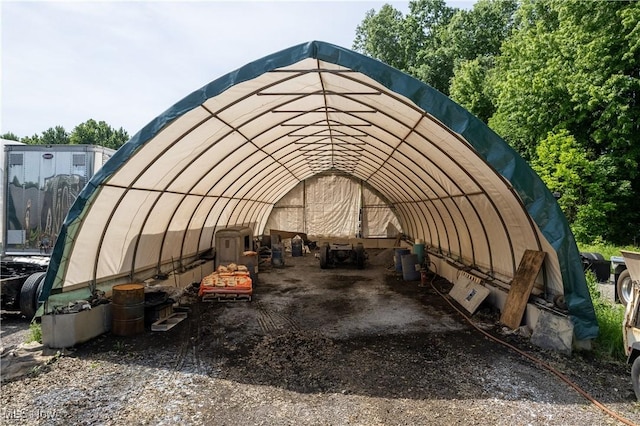 view of vehicle parking featuring a carport