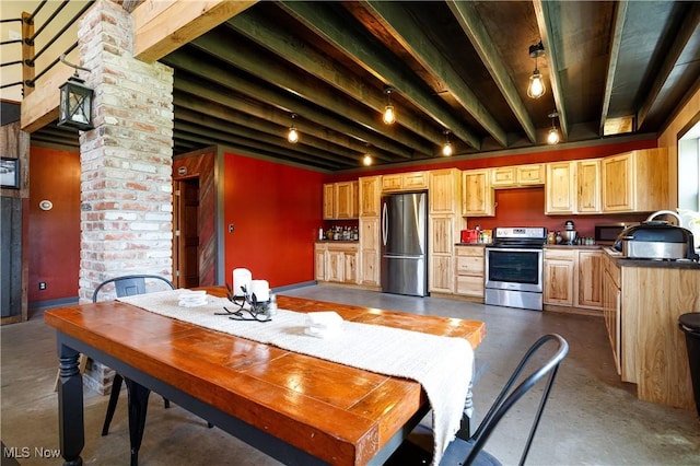 dining area featuring concrete floors